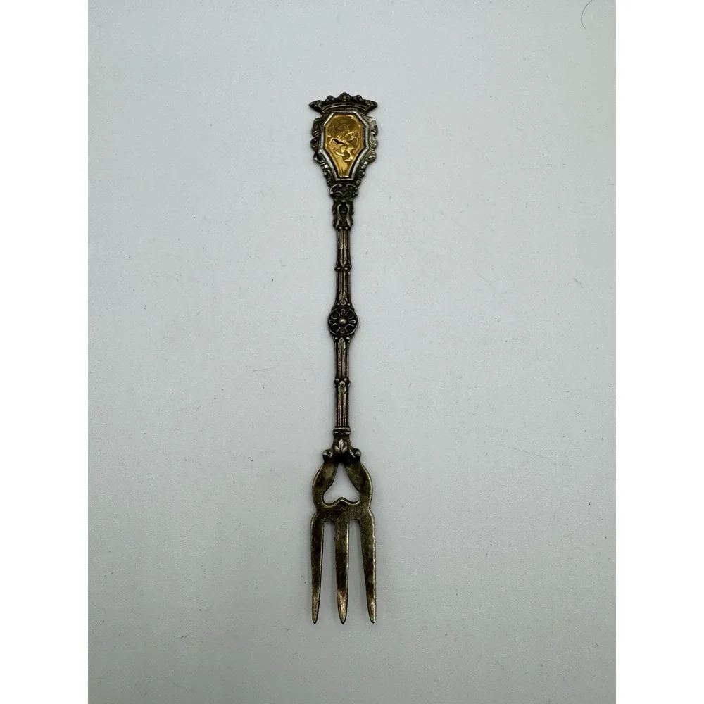 Ornate Italian souvenir fork with a lion rampant and crown motif
